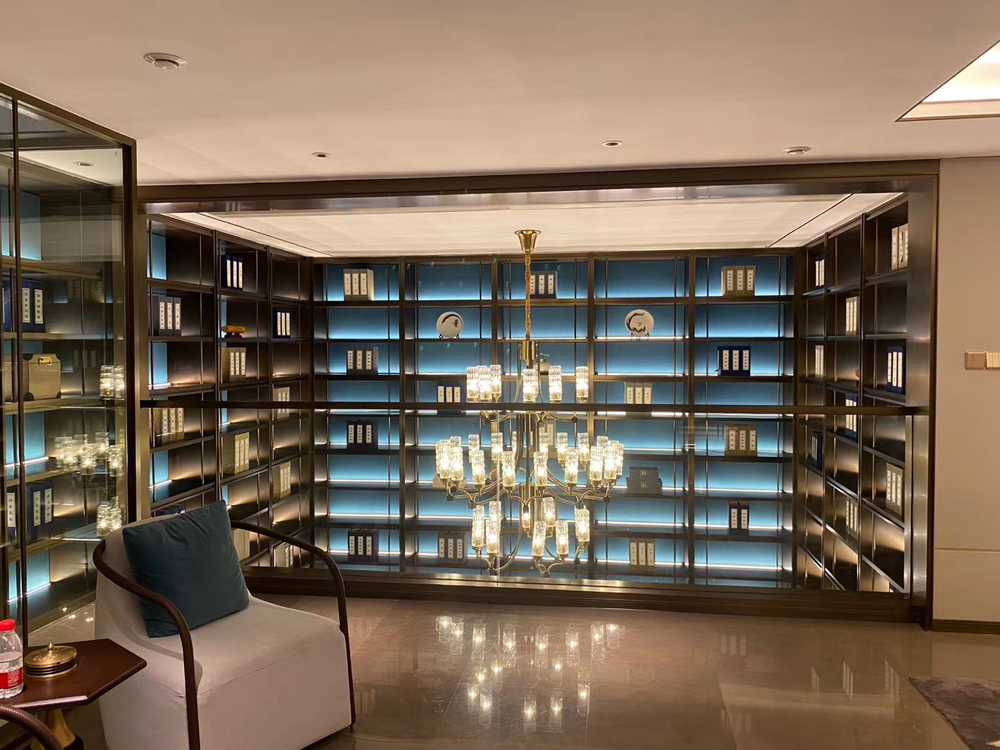 Hangzhou hospitality project finished view with recessed cabinet LED strip lighting and chandelier