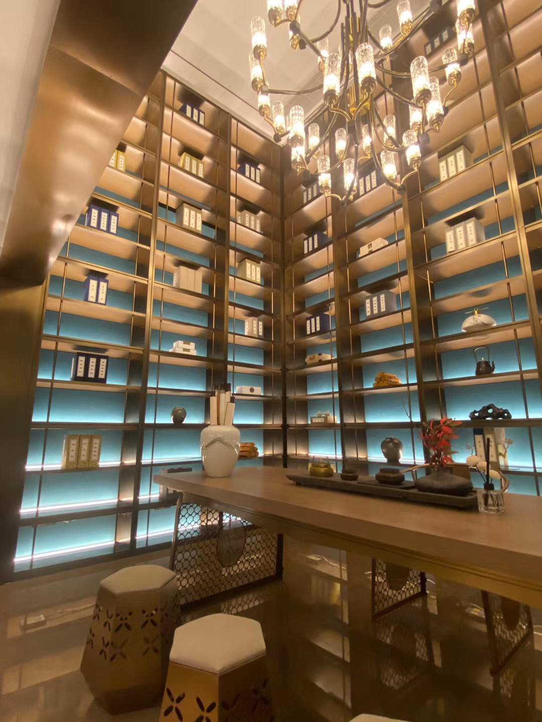 Hospitality reception area with decorative pendant lighting and layered ambient light