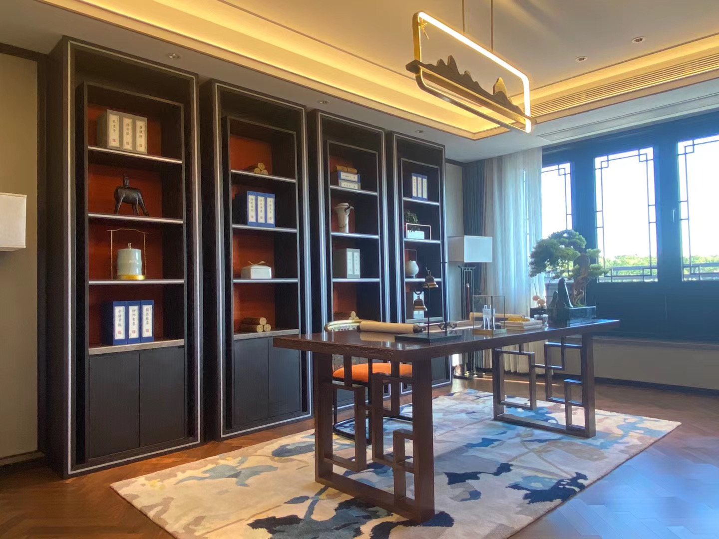 VIP room with ceiling LED strip lights, recessed shelf lights and decorative pendant lighting